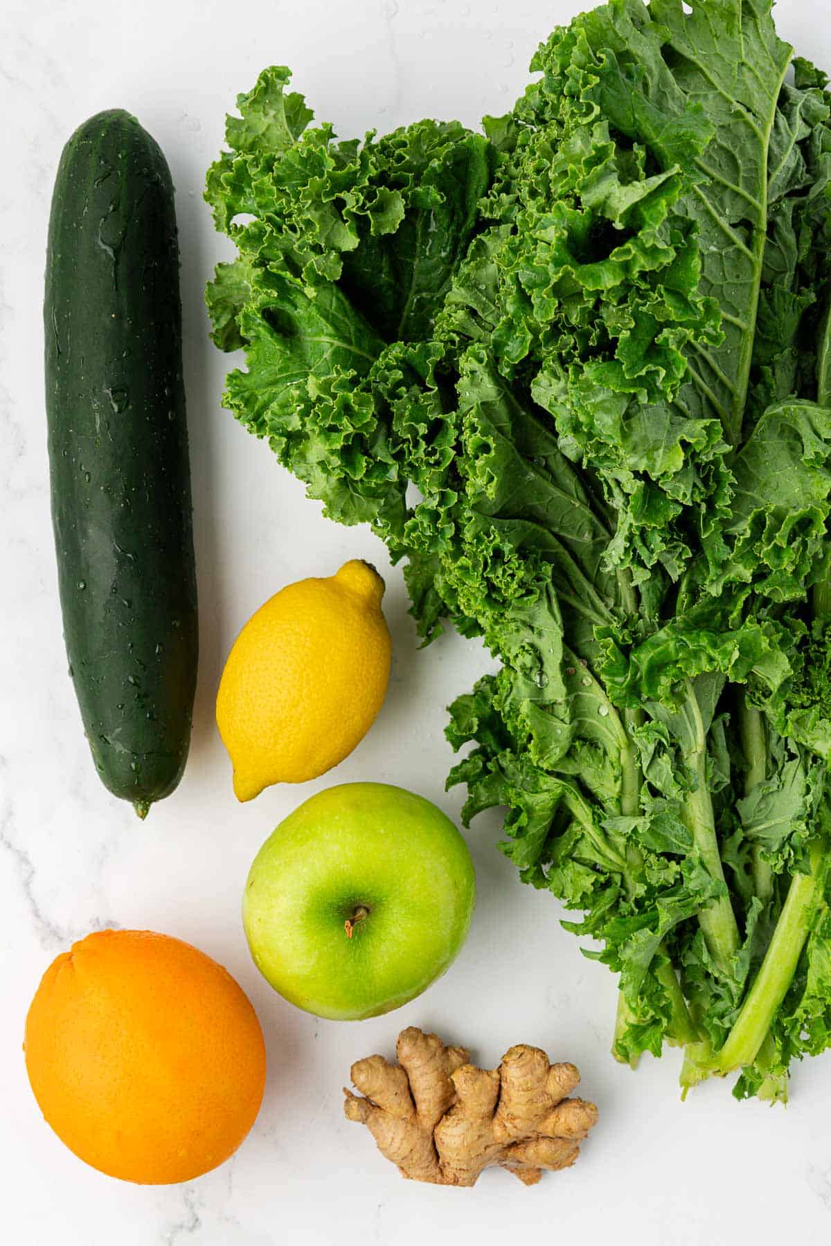 kale, cucumber, lemon, green apple, orange, and ginger