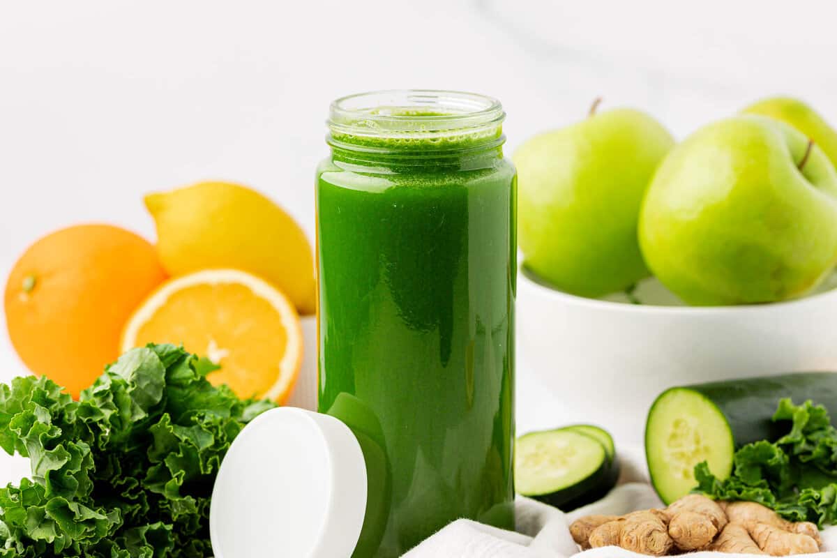 kale juice in a glass with a lid for storing