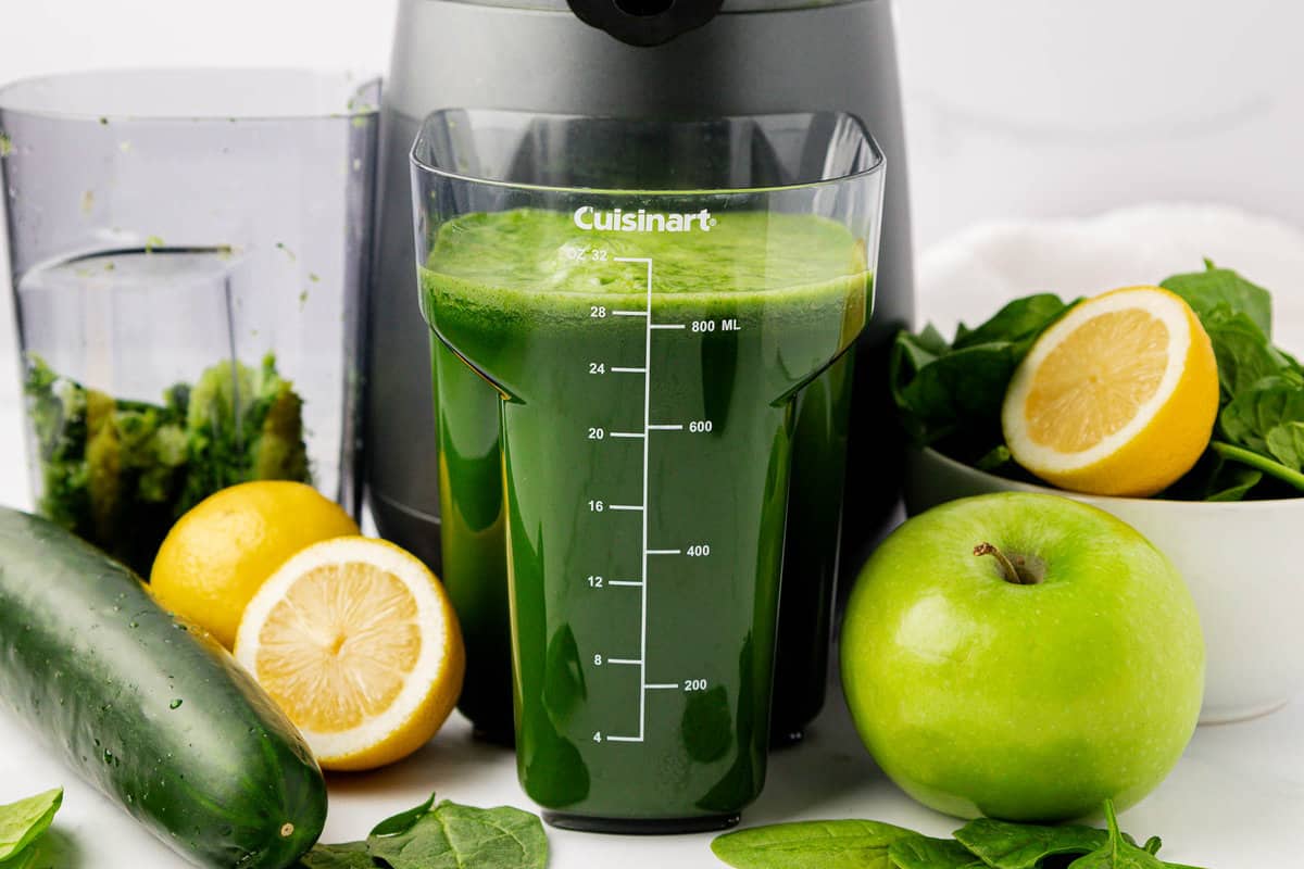 spinach juice in the juicing canister