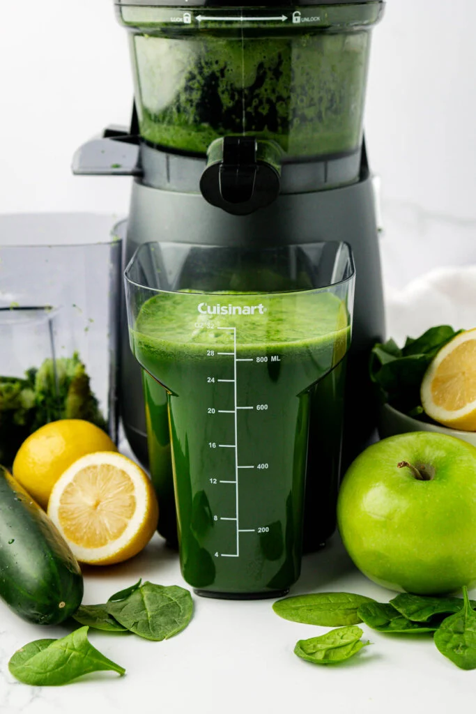 spinach juice in the juicing canister