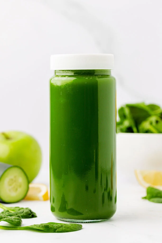 spinach juice in a storage jar with a lid