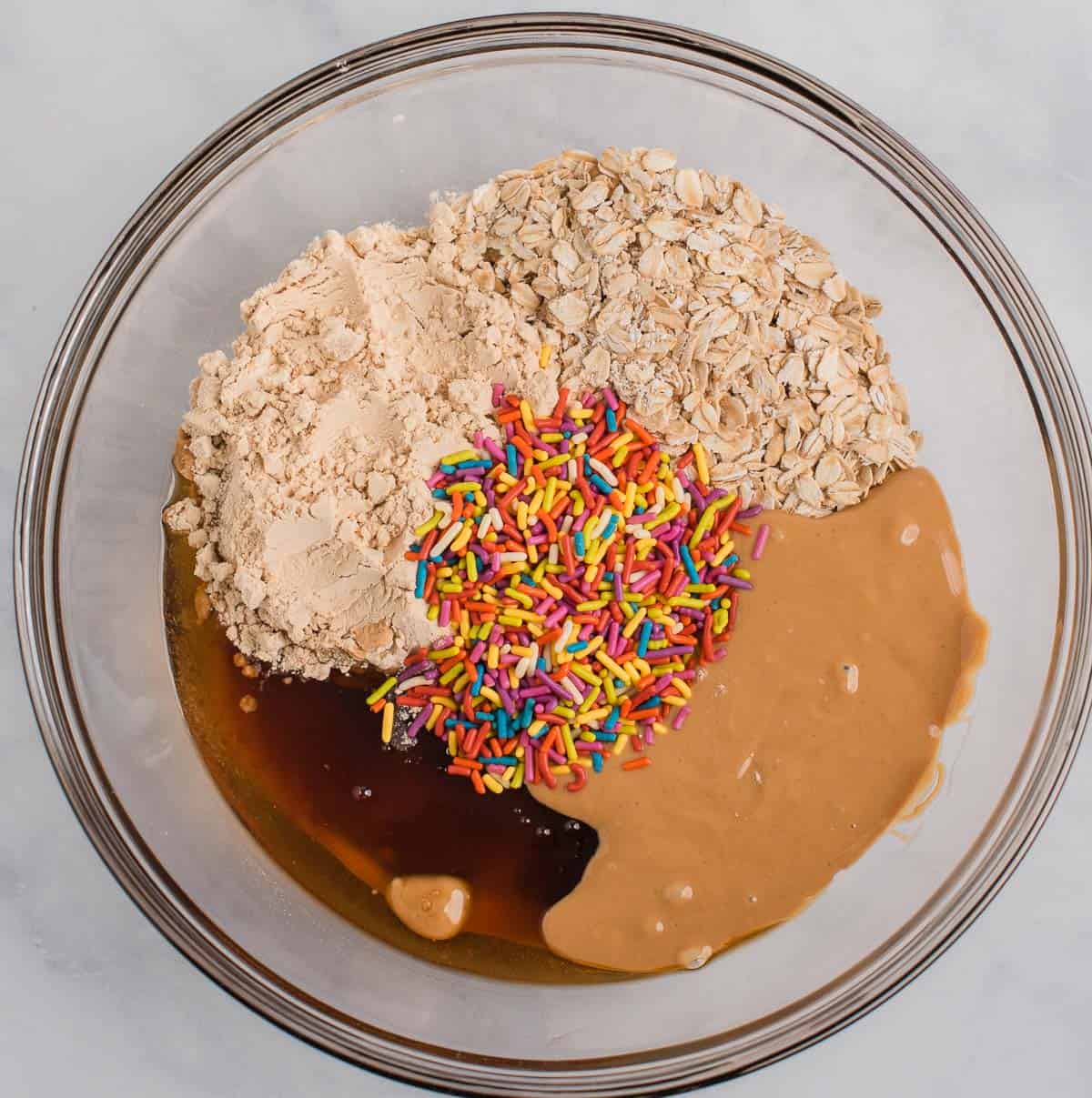 protein ball ingredients in a mixing bowl