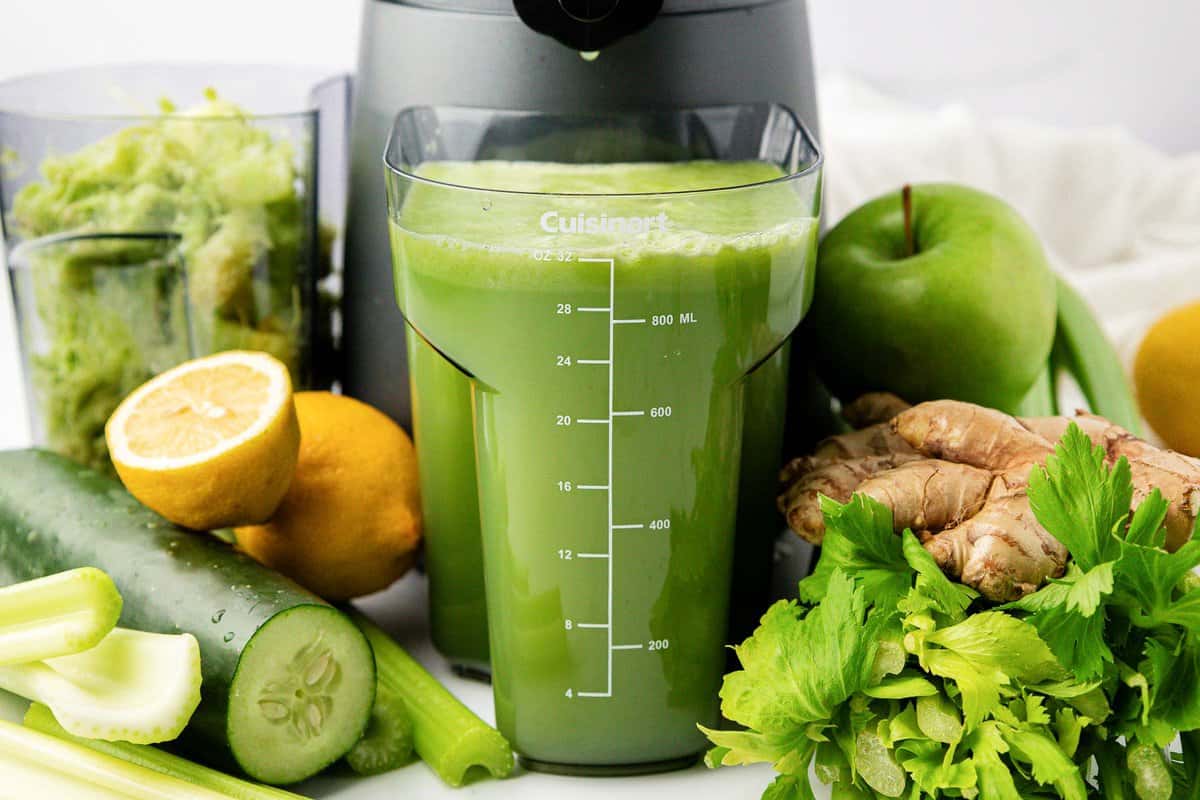 celery juice next to a juicer