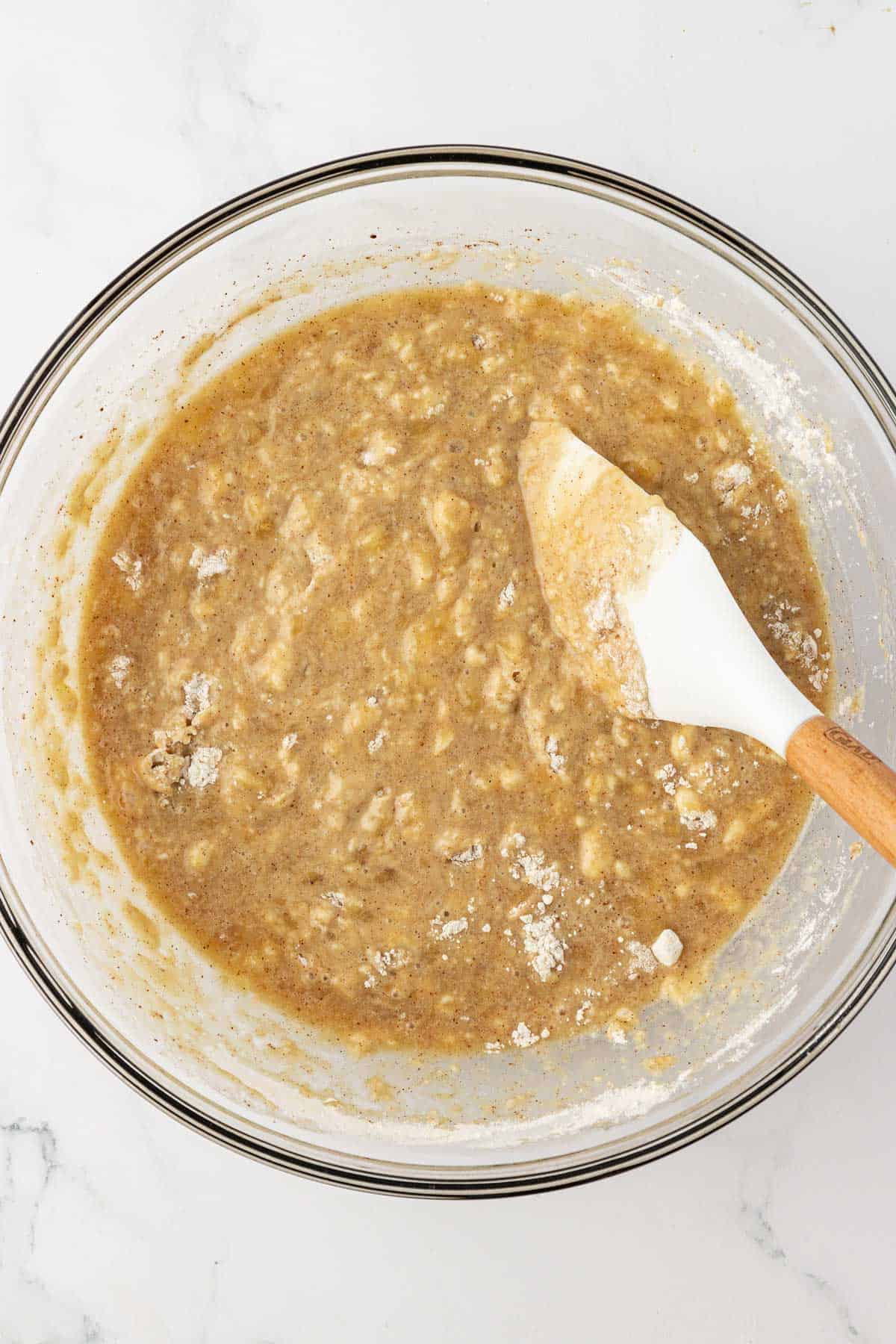 banana muffin batter mixed together in a bowl