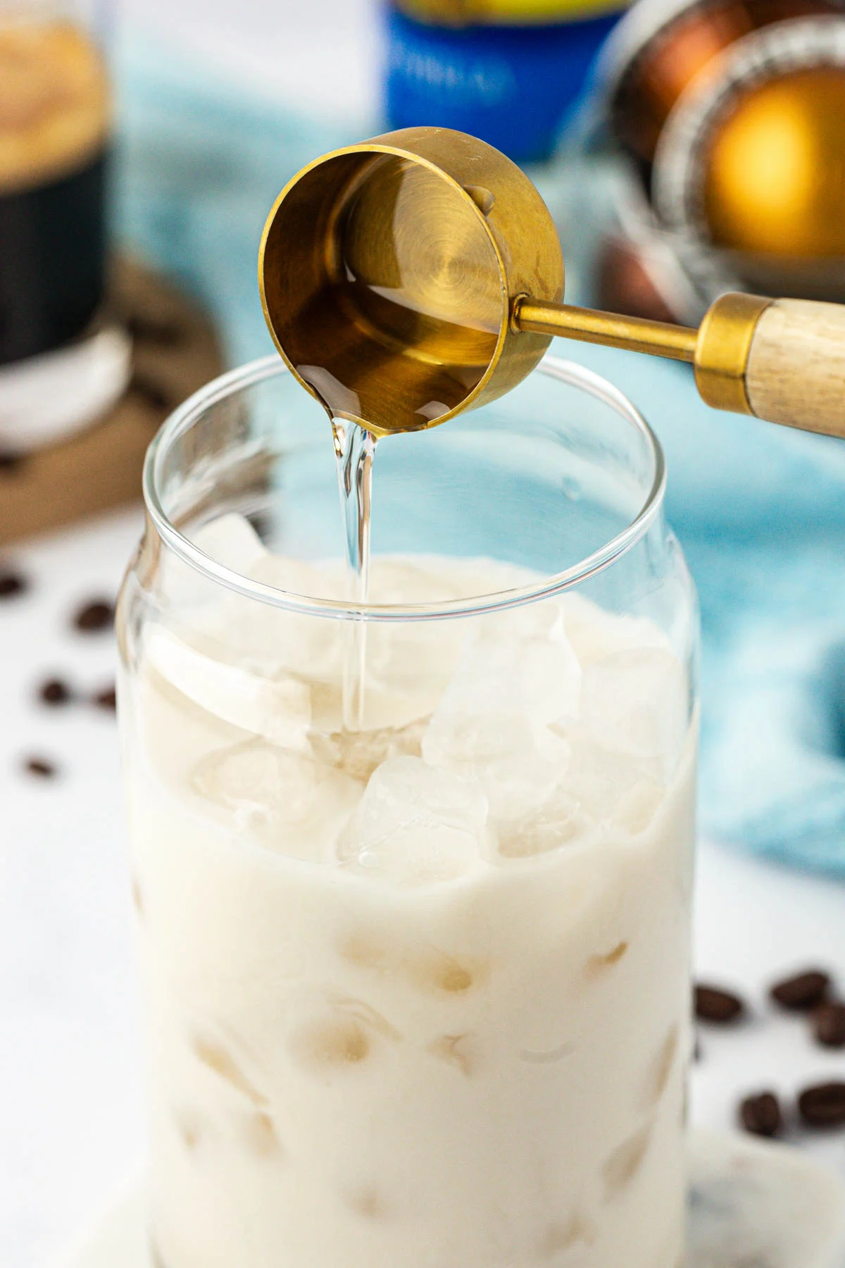pouring coffee syrup into a glass