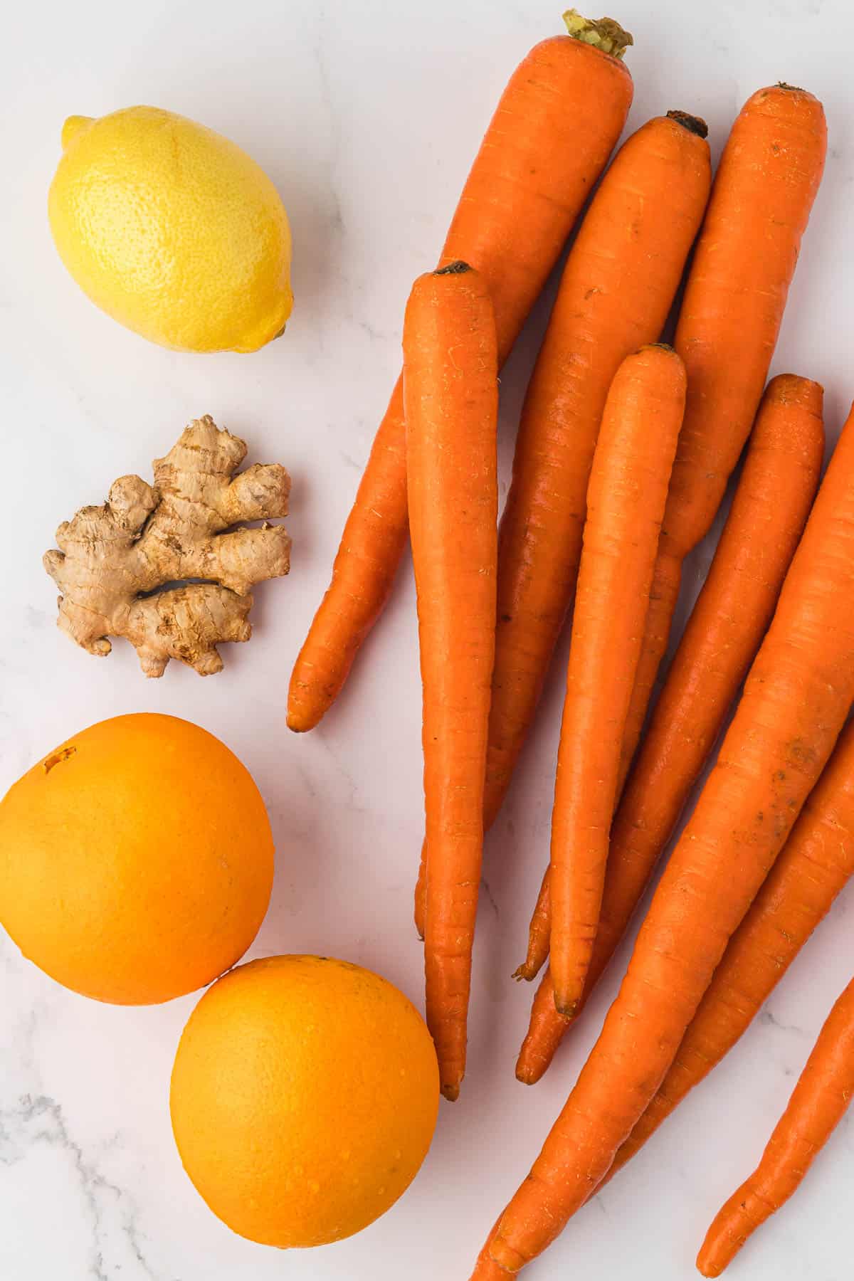 carrots, lemon, ginger, and oranges