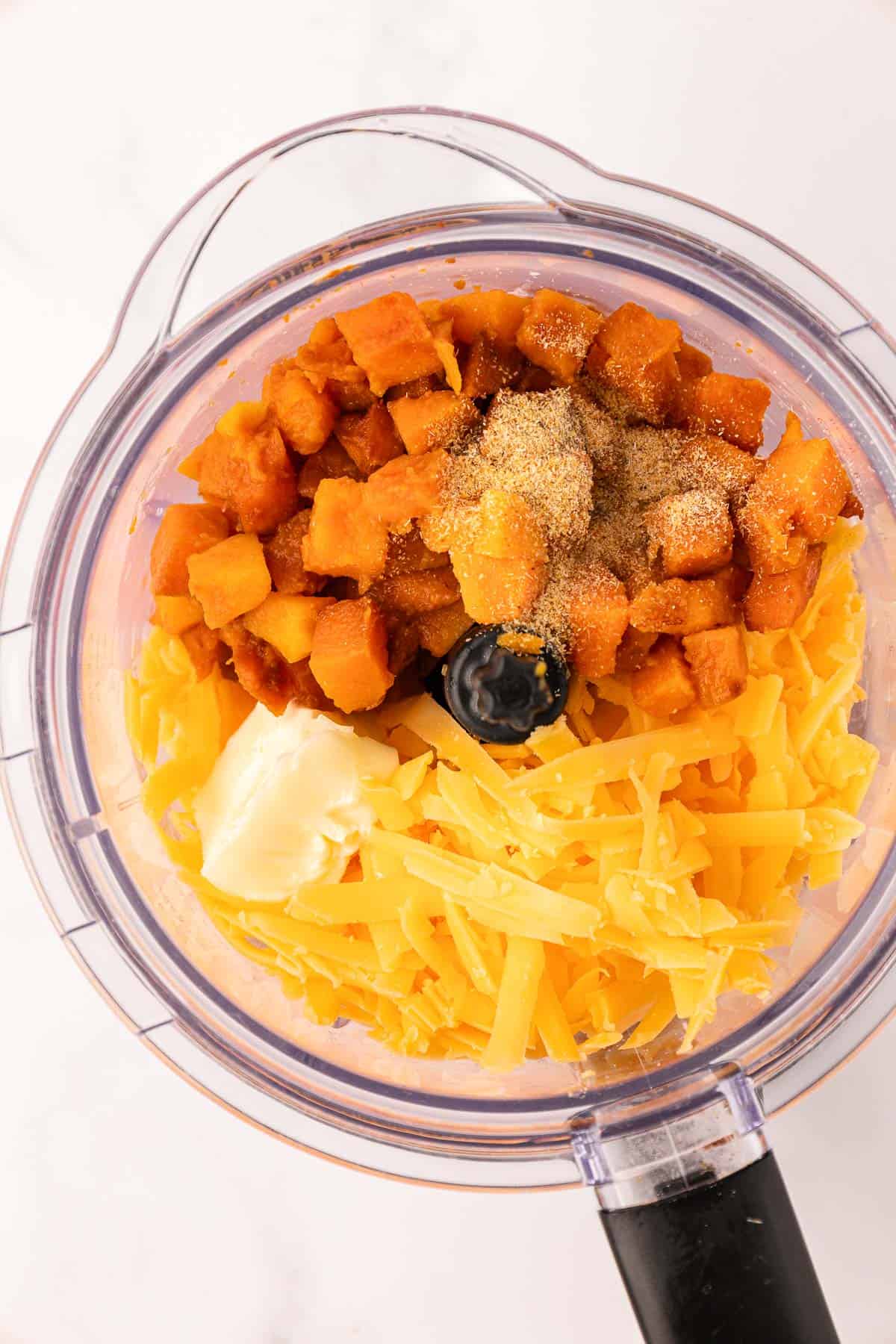 butternut squash, spices, cheese, and butter in a food processor