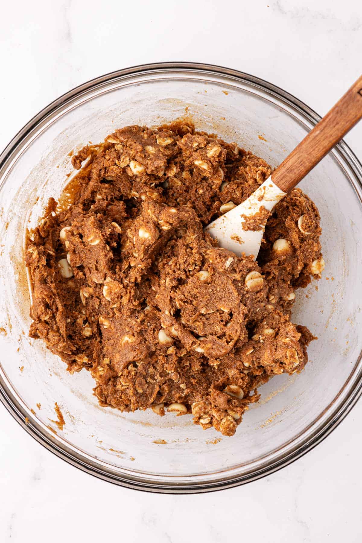 energy bite batter mixed together in a bowl with a rubber spatula