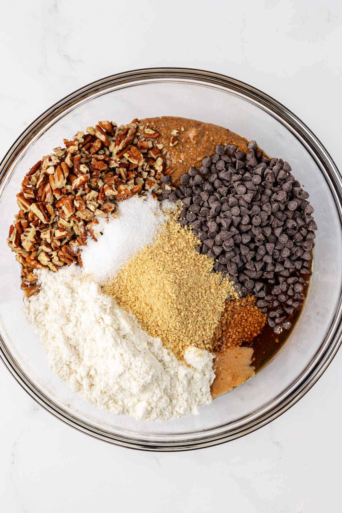 pecan pie energy bite ingredients in a mixing bowl