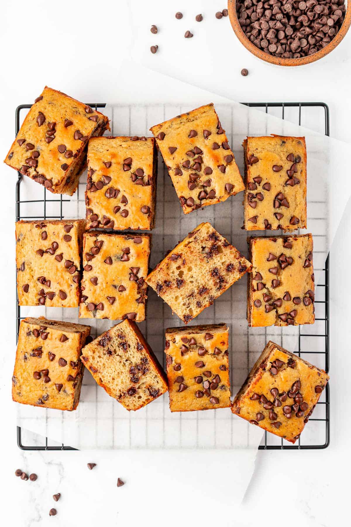 greek yogurt snack cake squares on a cooling rack