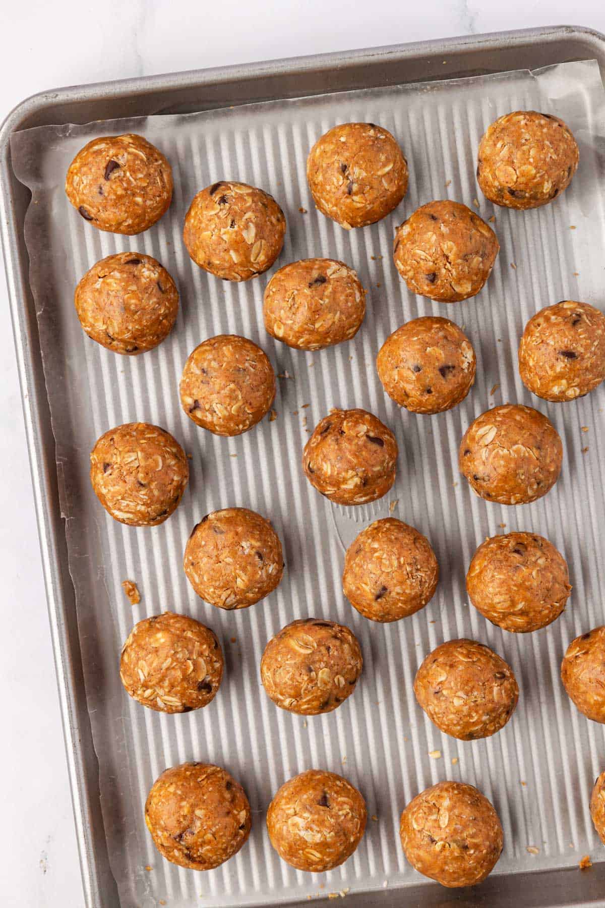 oatmeal cookie energy balls on a baking sheet