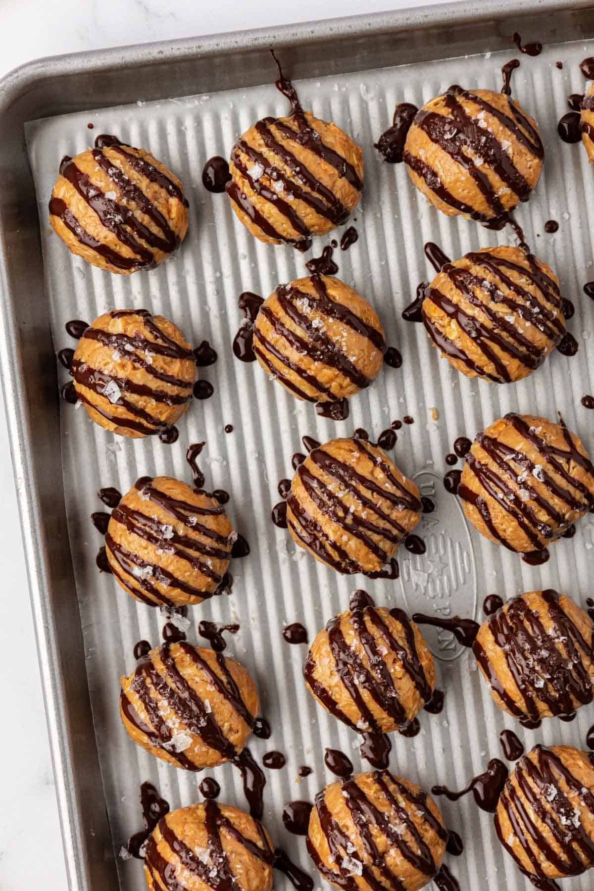 peanut butter energy bites drizzled with dark chocolate