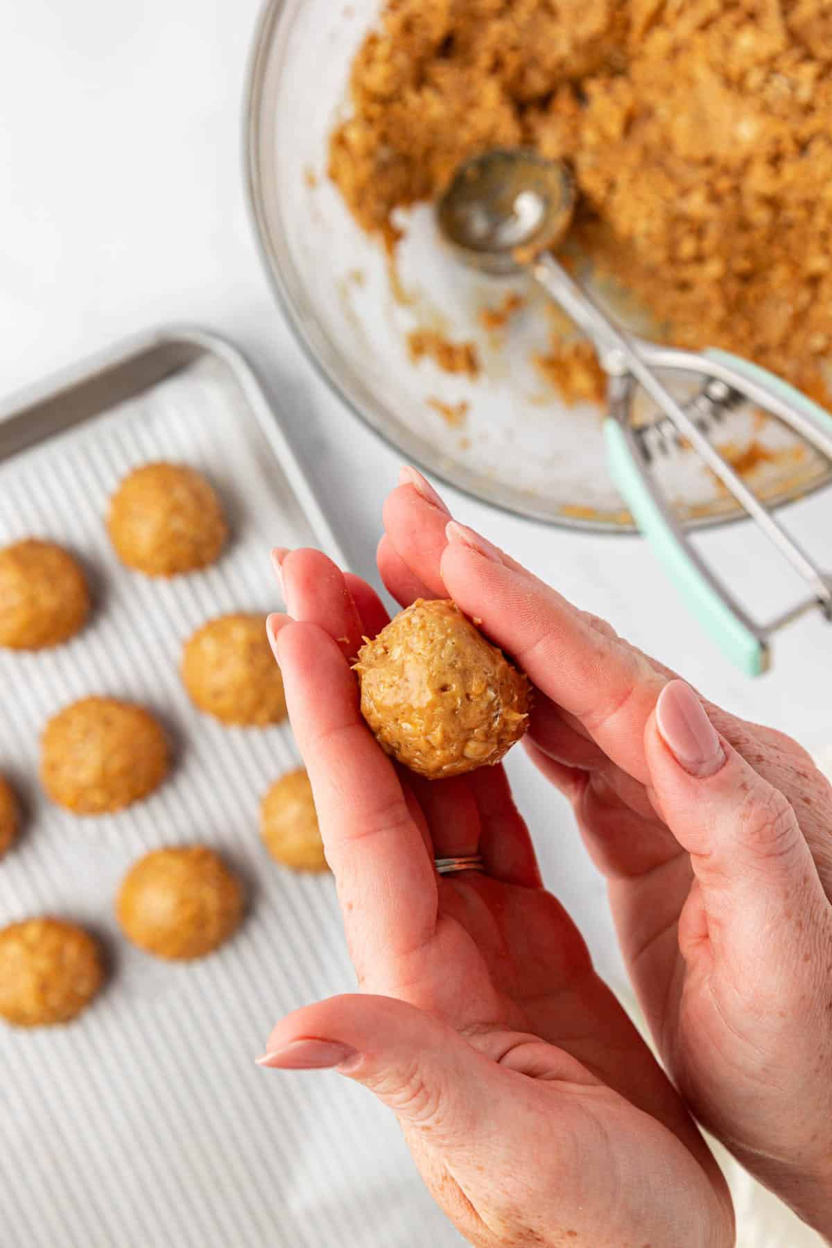 hands rolling a protein ball