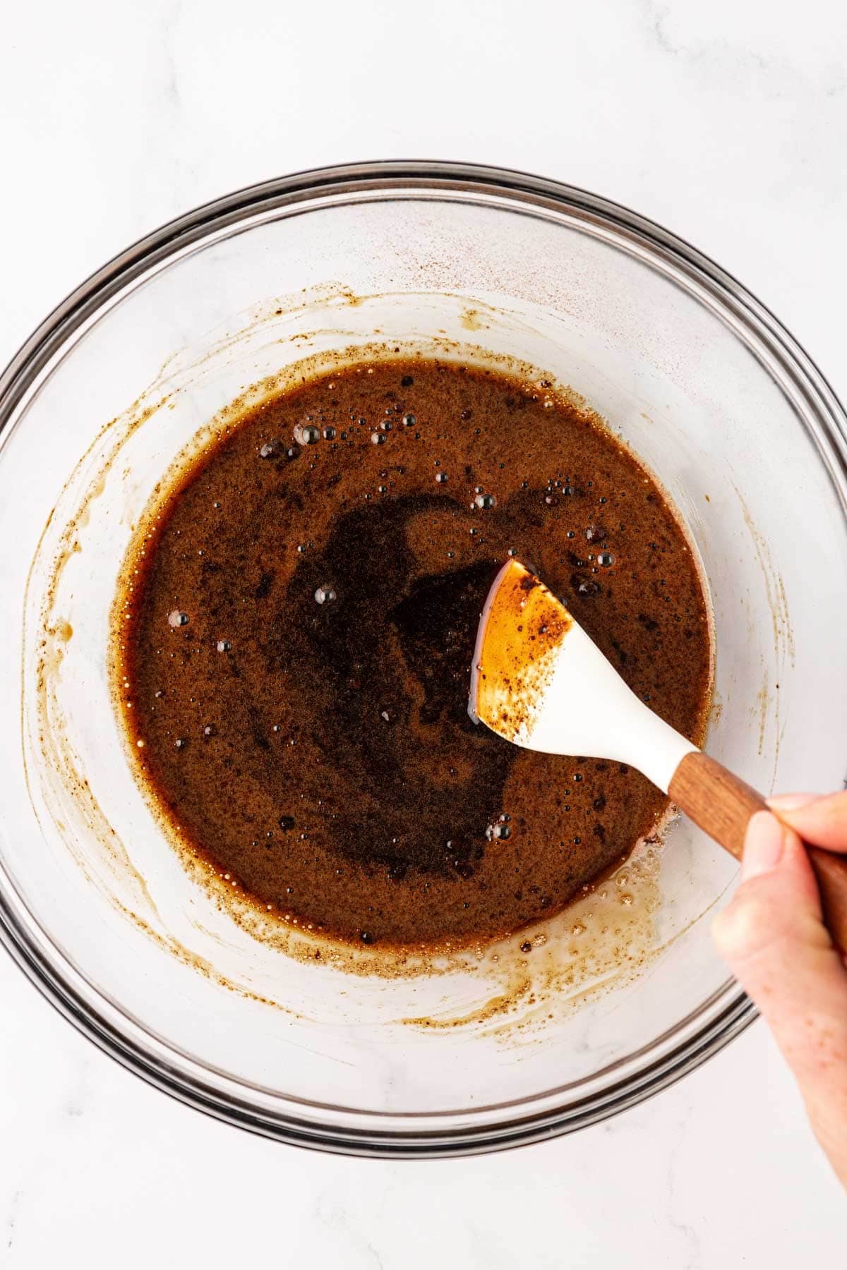 mixing the instant espresso into the maple syrup