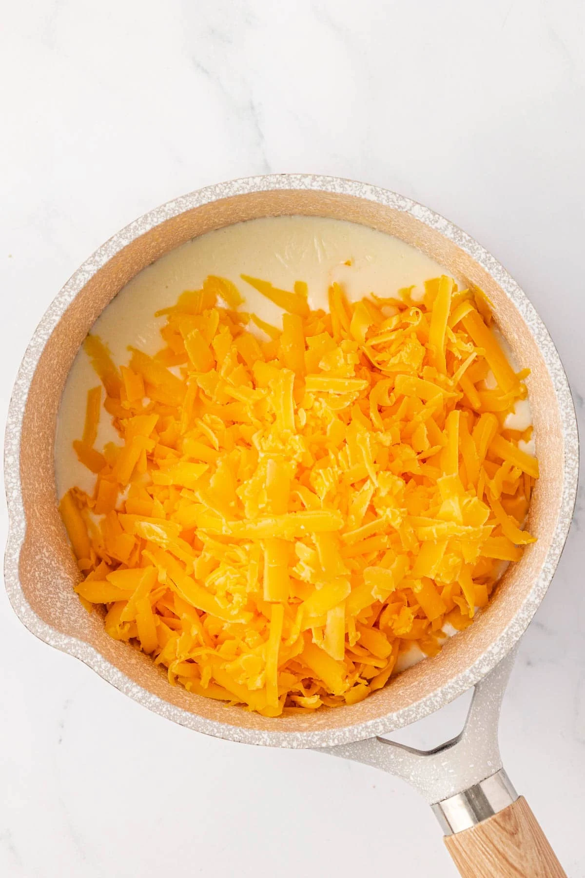 adding the cheese to the roux