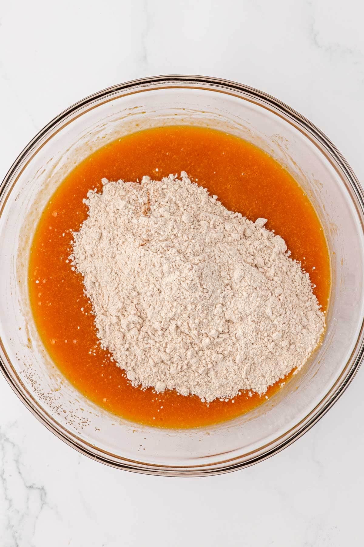 adding the dry ingredients to the wet ingredients