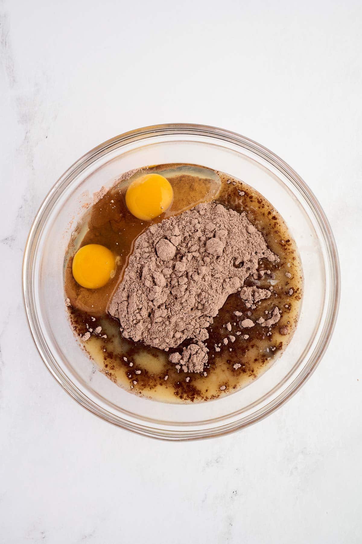 eggs, melted butter, and cake mix in a mixing bowl