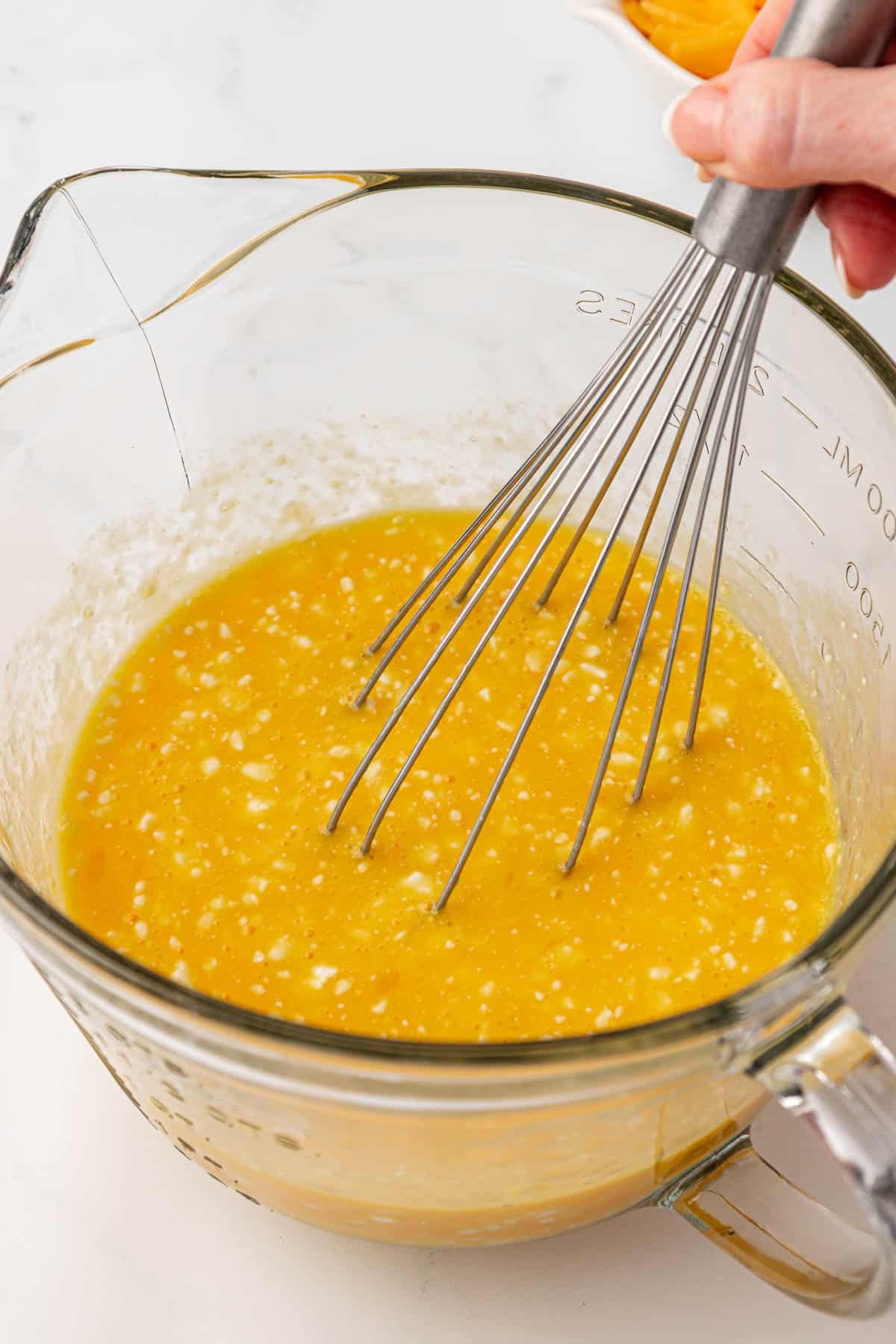 whisking eggs and cottage cheese together