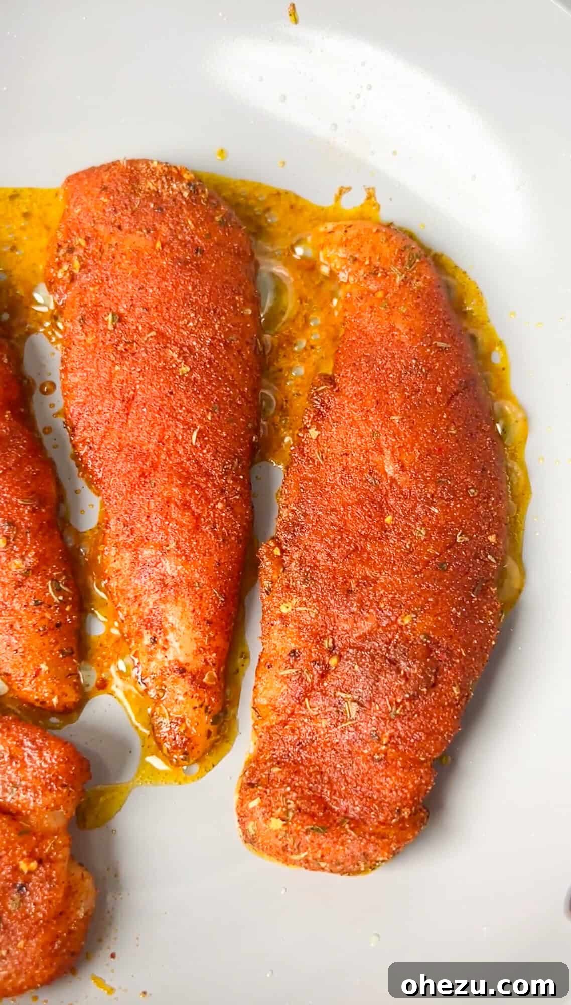 Cajun Chicken Wraps 6 Chicken tenders being seasoned with blackened spice mix