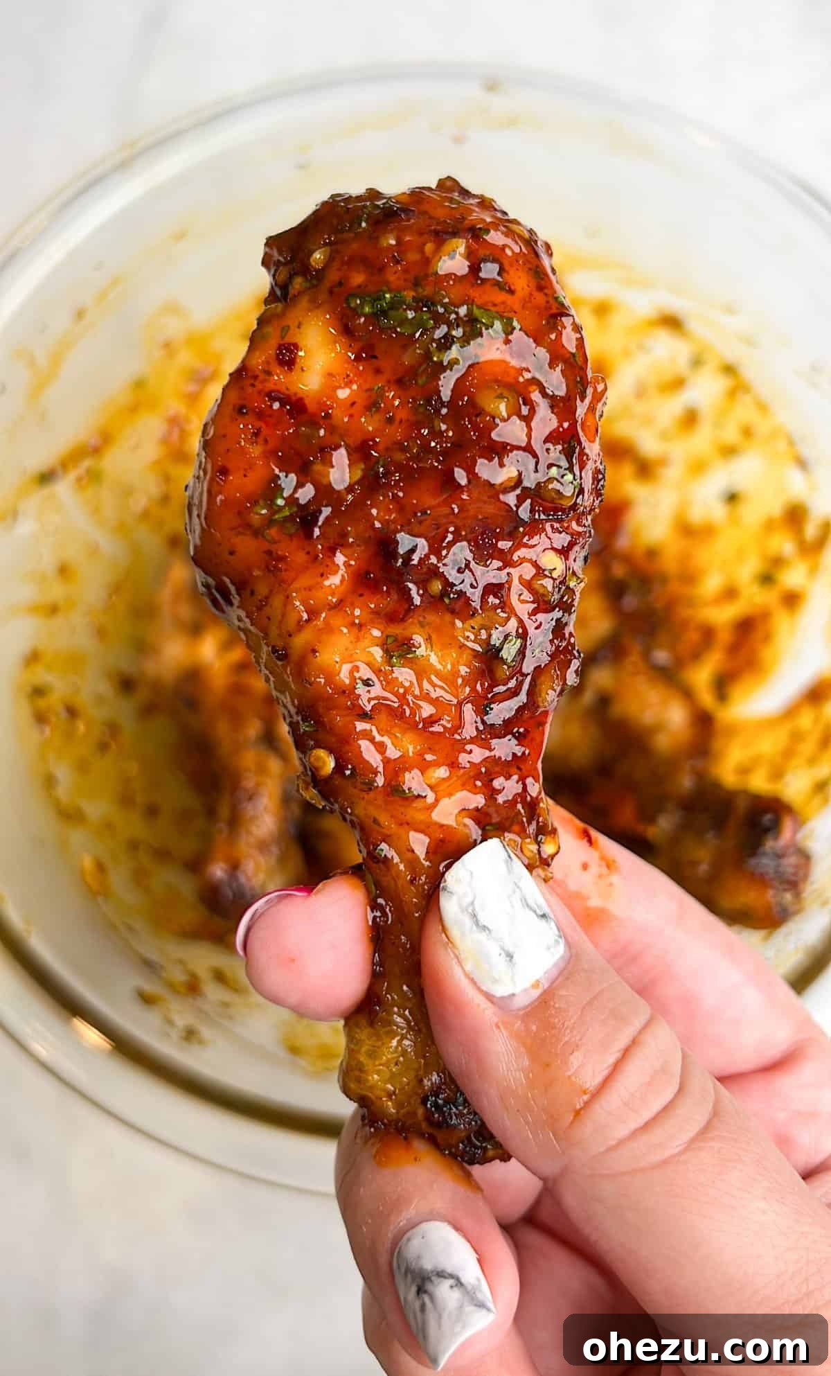 Crispy Air-Fried Sweet Chili Wings 2 A vibrant platter of Crispy Air Fried Sweet Chili Chicken Wings, garnished with fresh cilantro and lime wedges, showcasing their golden crispiness and sticky sauce.