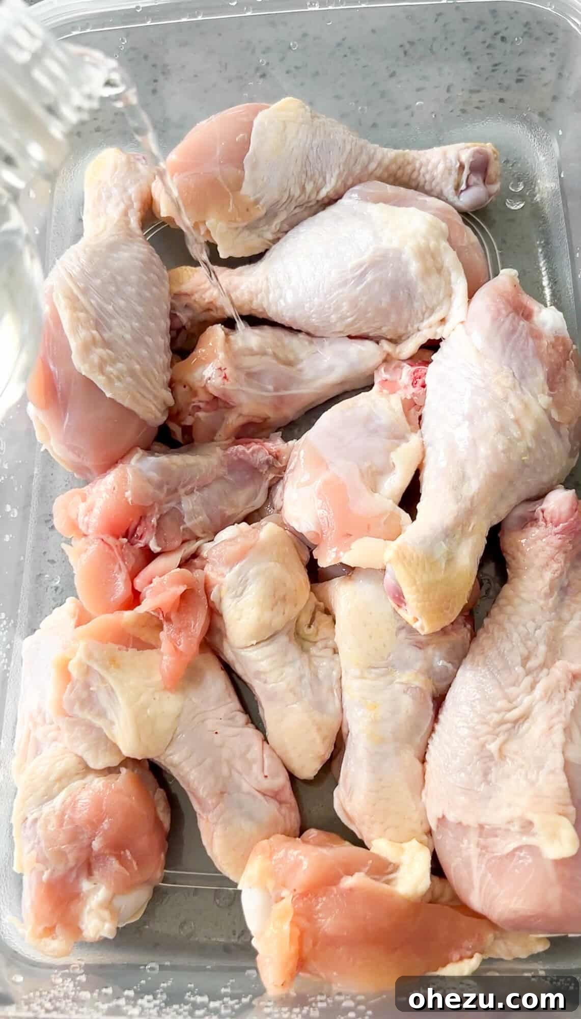 Crispy Air-Fried Sweet Chili Wings 5 Raw chicken wings with shallow cuts, prepped and ready for seasoning.
