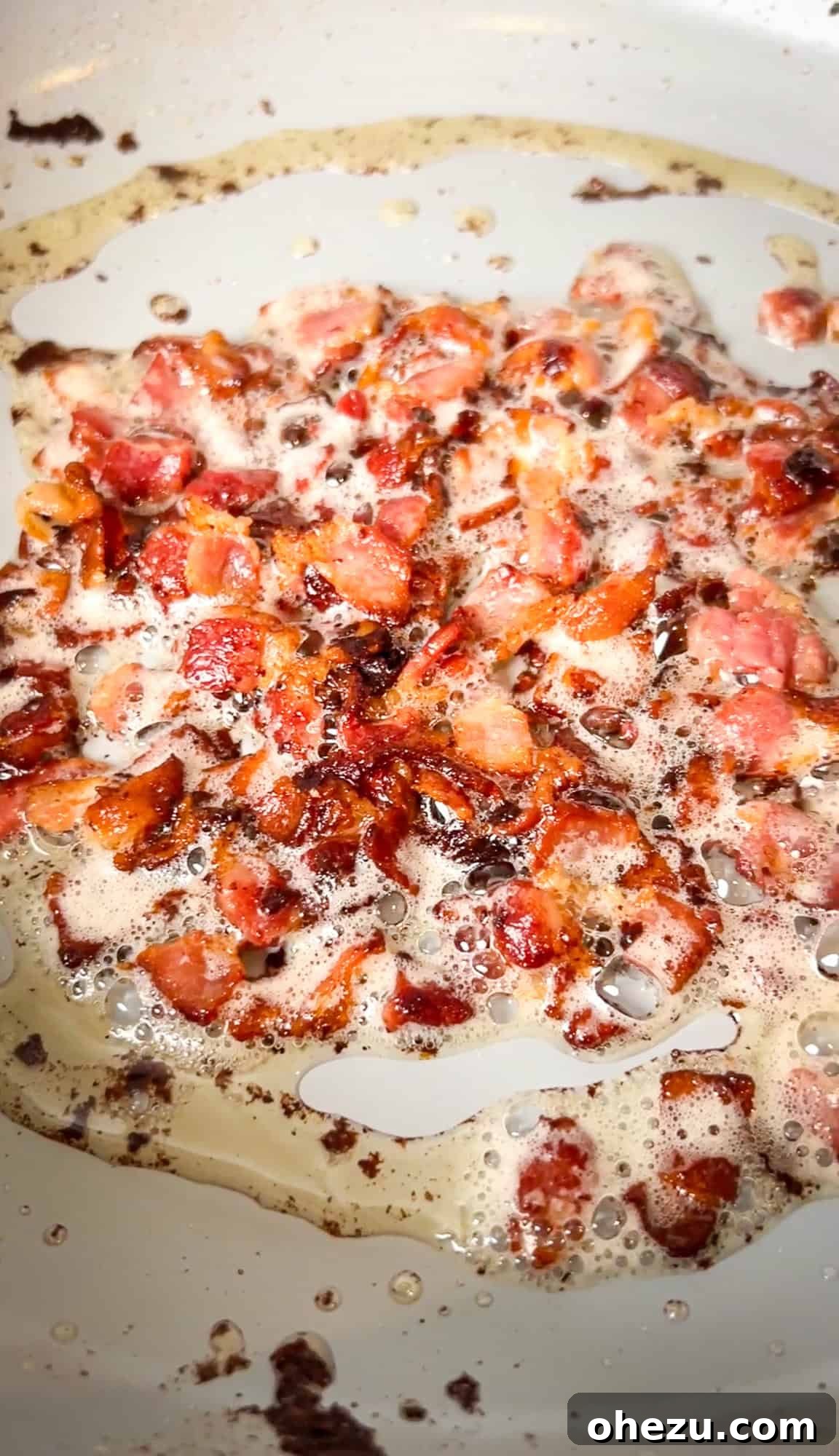 Soulful Southern Smothered Chicken 6 diced bacon cooking in a skillet