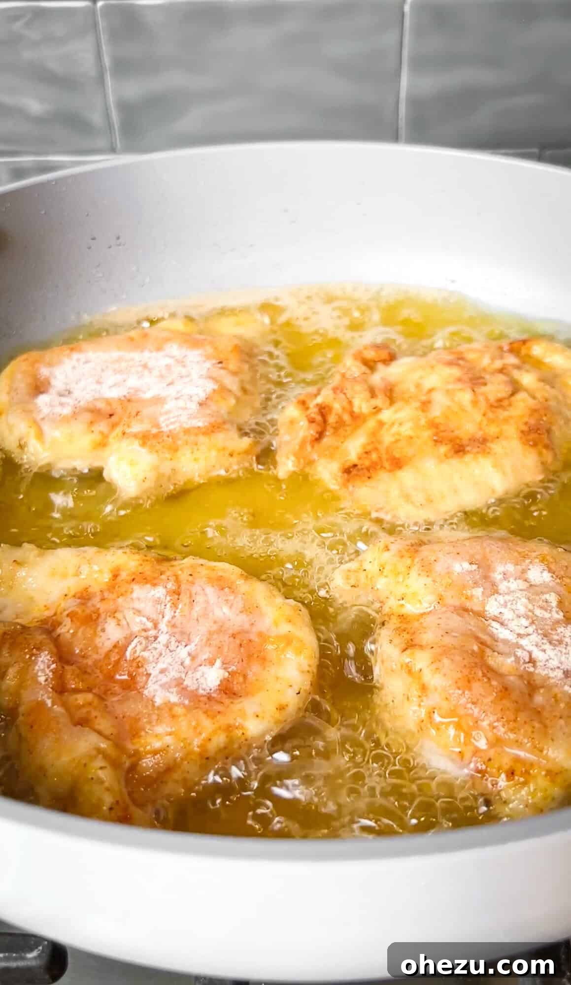 Soulful Southern Smothered Chicken 8 browning chicken in hot oil