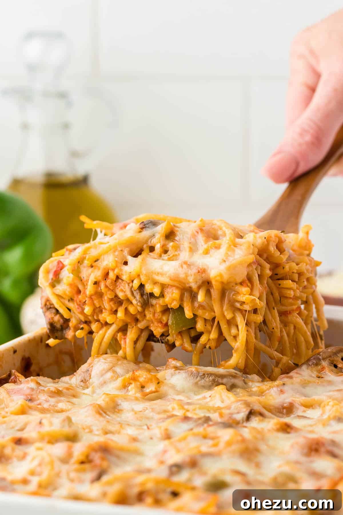 A full casserole dish of vegetarian baked spaghetti, untouched and ready to be served or stored.