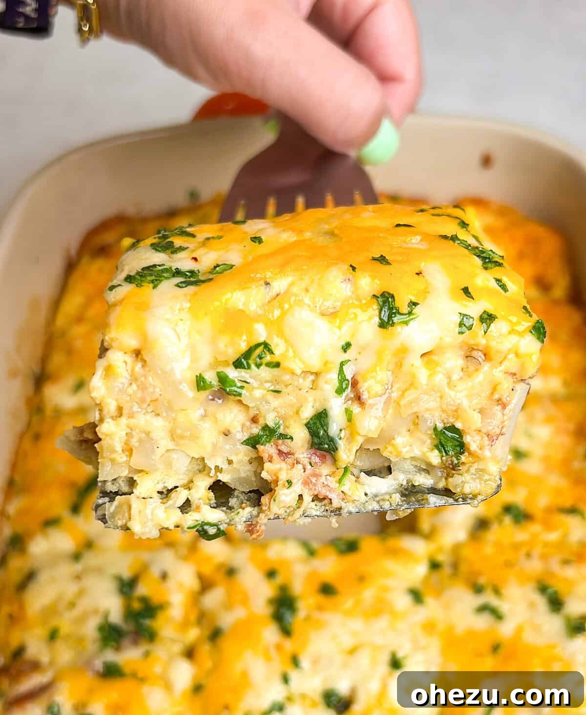 Delicious breakfast casserole with golden hashbrowns and melted cheese
