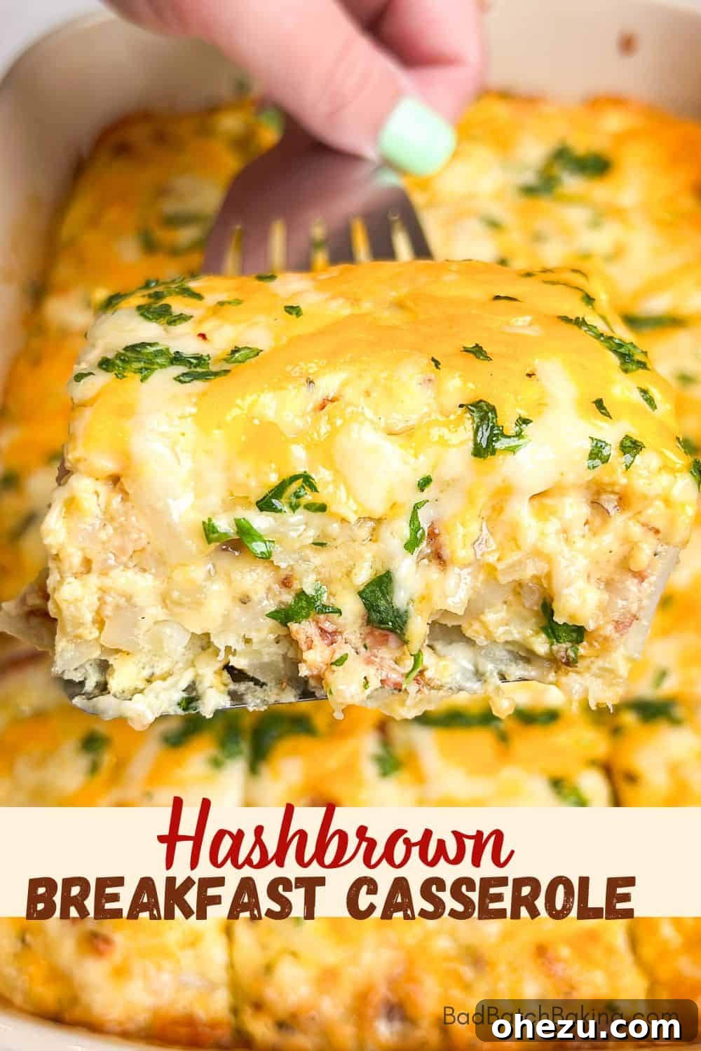A large serving of breakfast casserole with hashbrowns, bacon, and cheese