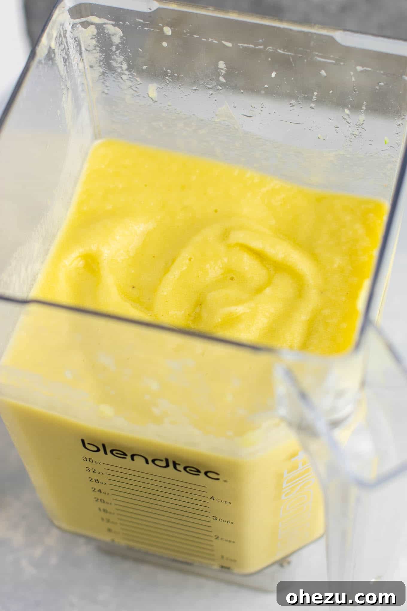 A thick and healthy pineapple detox smoothie, showing its creamy, ice cream-like consistency