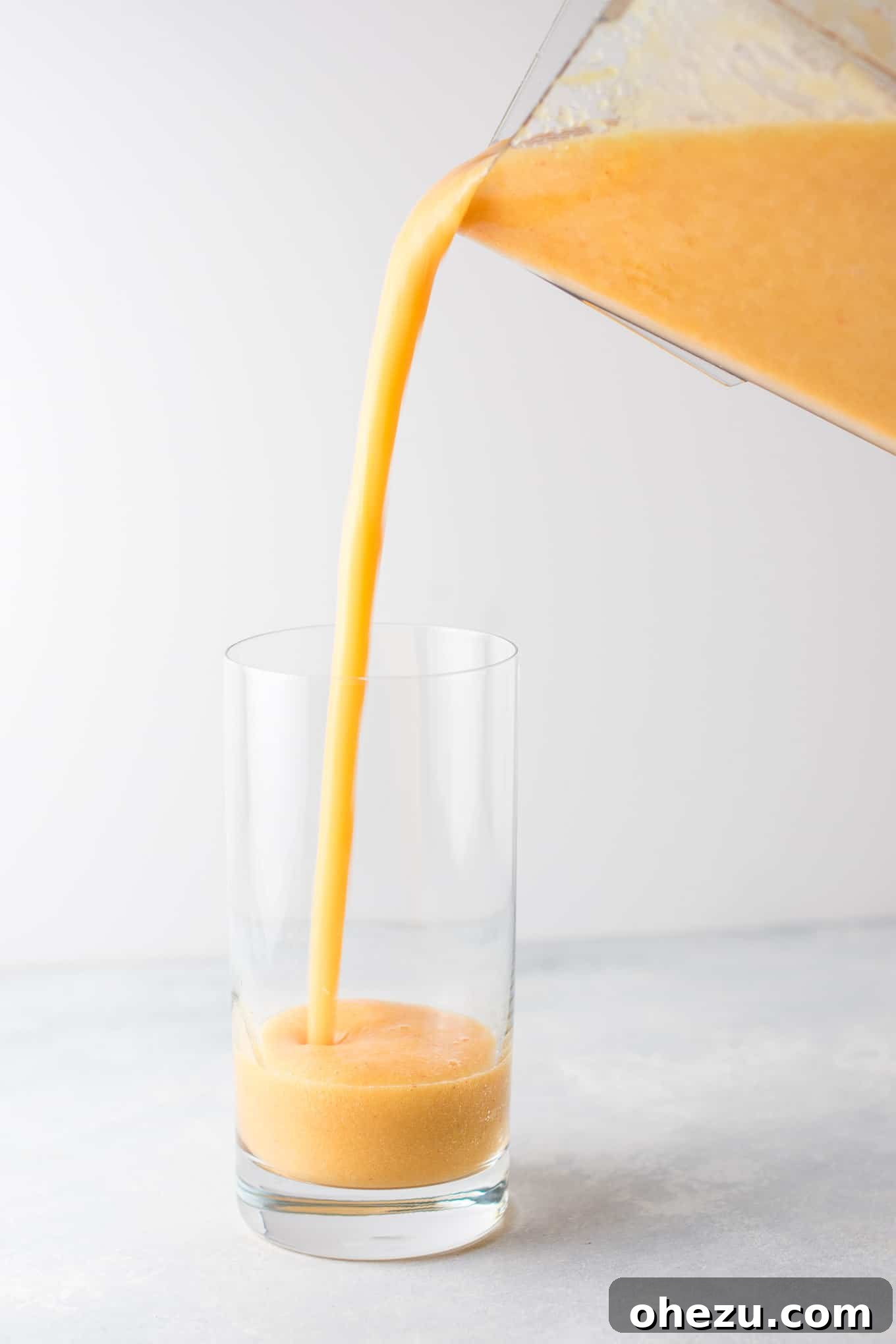 A selection of fresh ingredients for a smoothie without milk, including fruits and vegetables