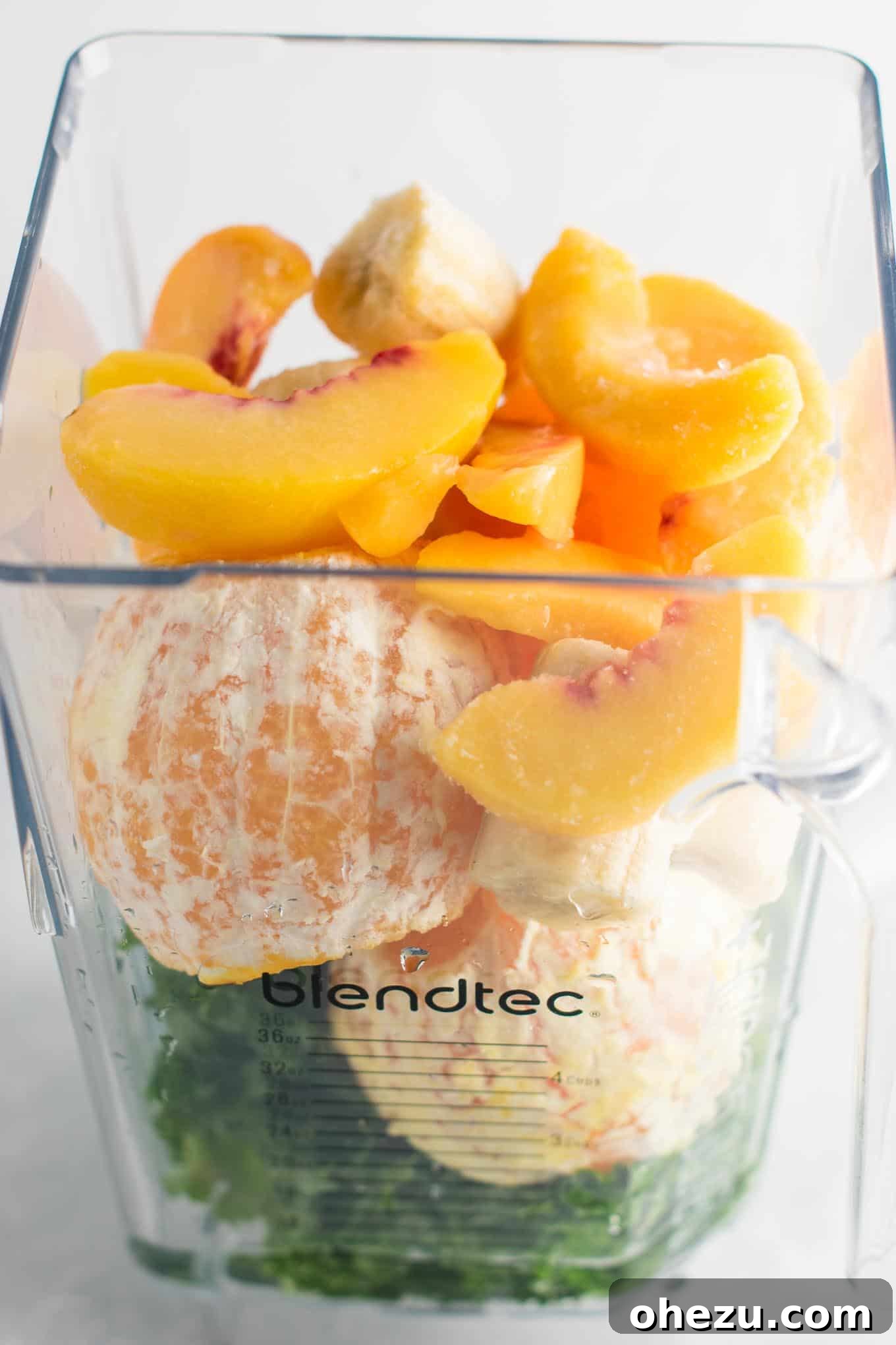 A close-up of a perfectly blended green smoothie, showcasing its smooth texture