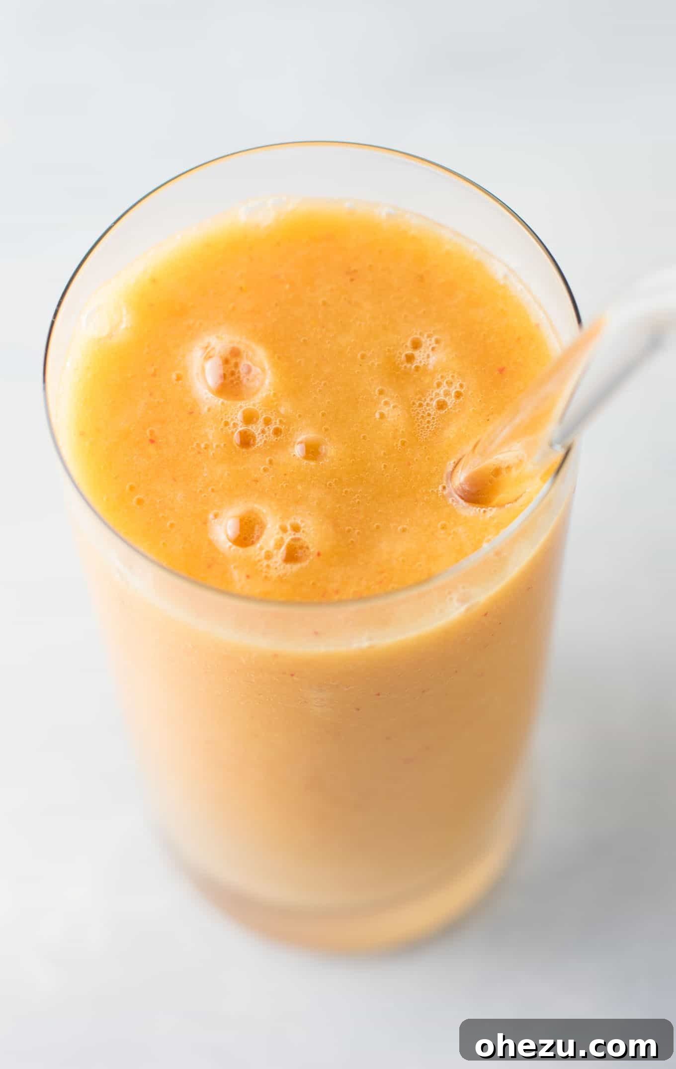 Ginger peach detox smoothie recipe featuring fresh cucumber and lemon for a detoxifying drink