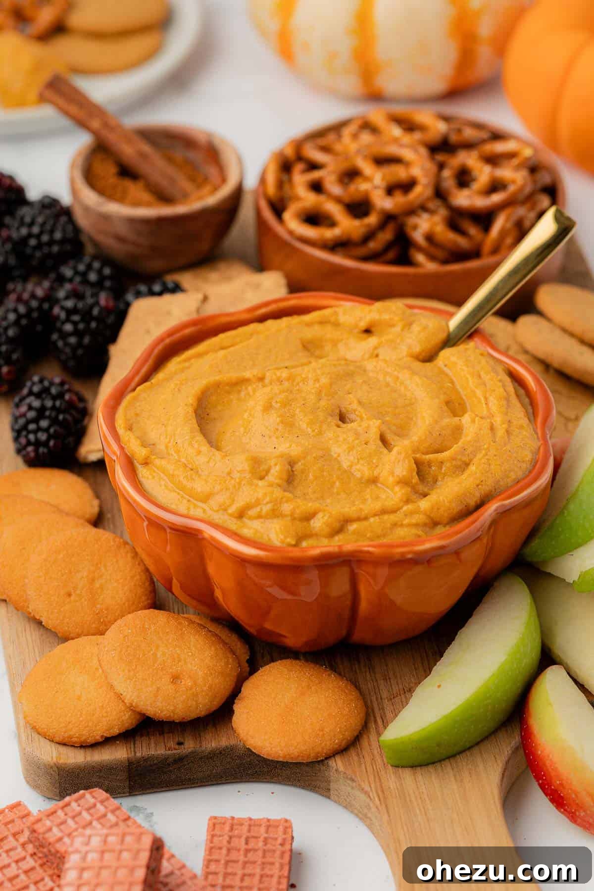 A bowl brimming with creamy pumpkin cream cheese dip, ready for serving