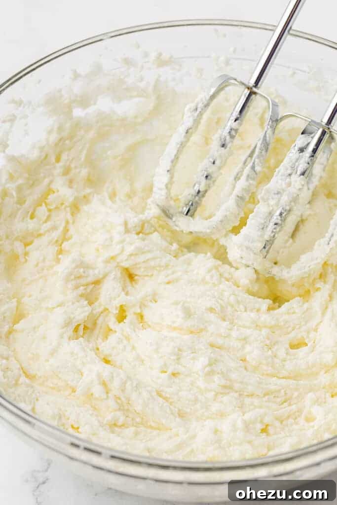 Freshly whipped cream with stiff peaks formed, ready to be incorporated