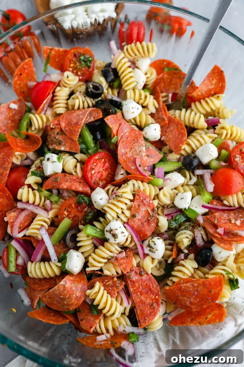 Easy Pizza Pasta Salad with Pepperoni, Mozzarella, and Italian dressing