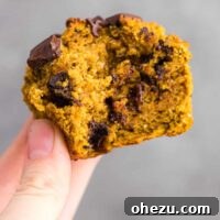 holding a gluten free pumpkin muffin