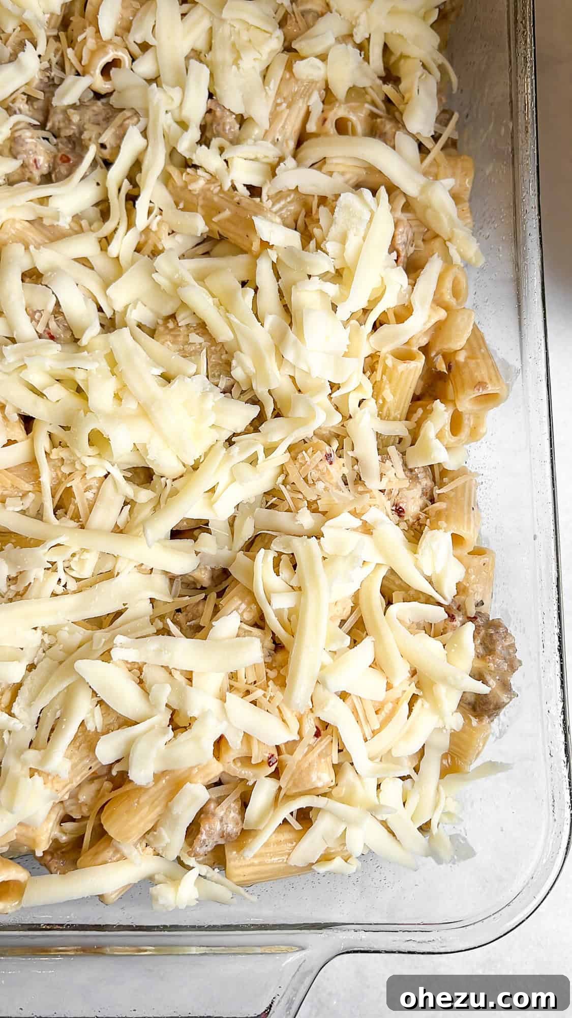 Hearty Creamy Sausage Alfredo Bake 8 combining ingredients for sausage alfredo bake