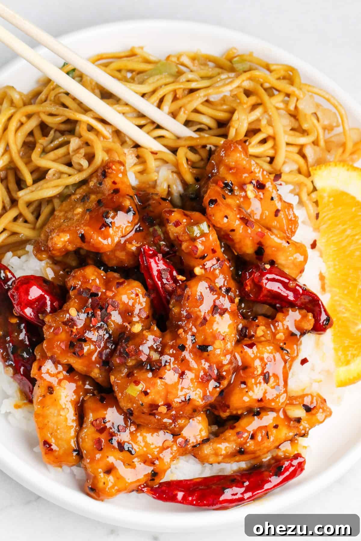 Close-up of crispy hot orange chicken pieces