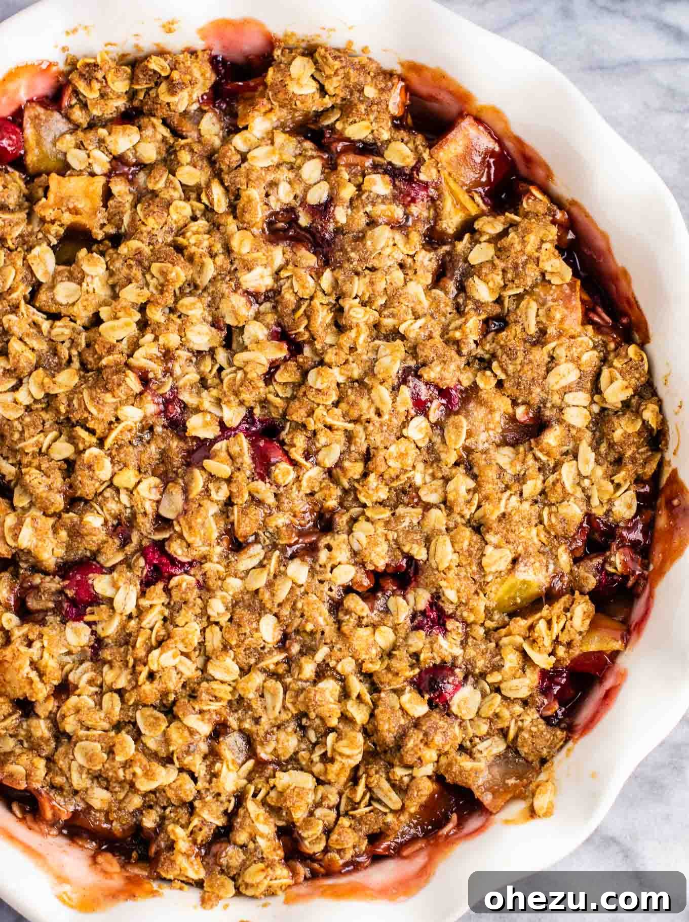 Sweet-Tart Cranberry Apple Crumble 5 Close-up of the delicious crisp topping mixture, showing the oats, nuts, and brown sugar texture before baking.