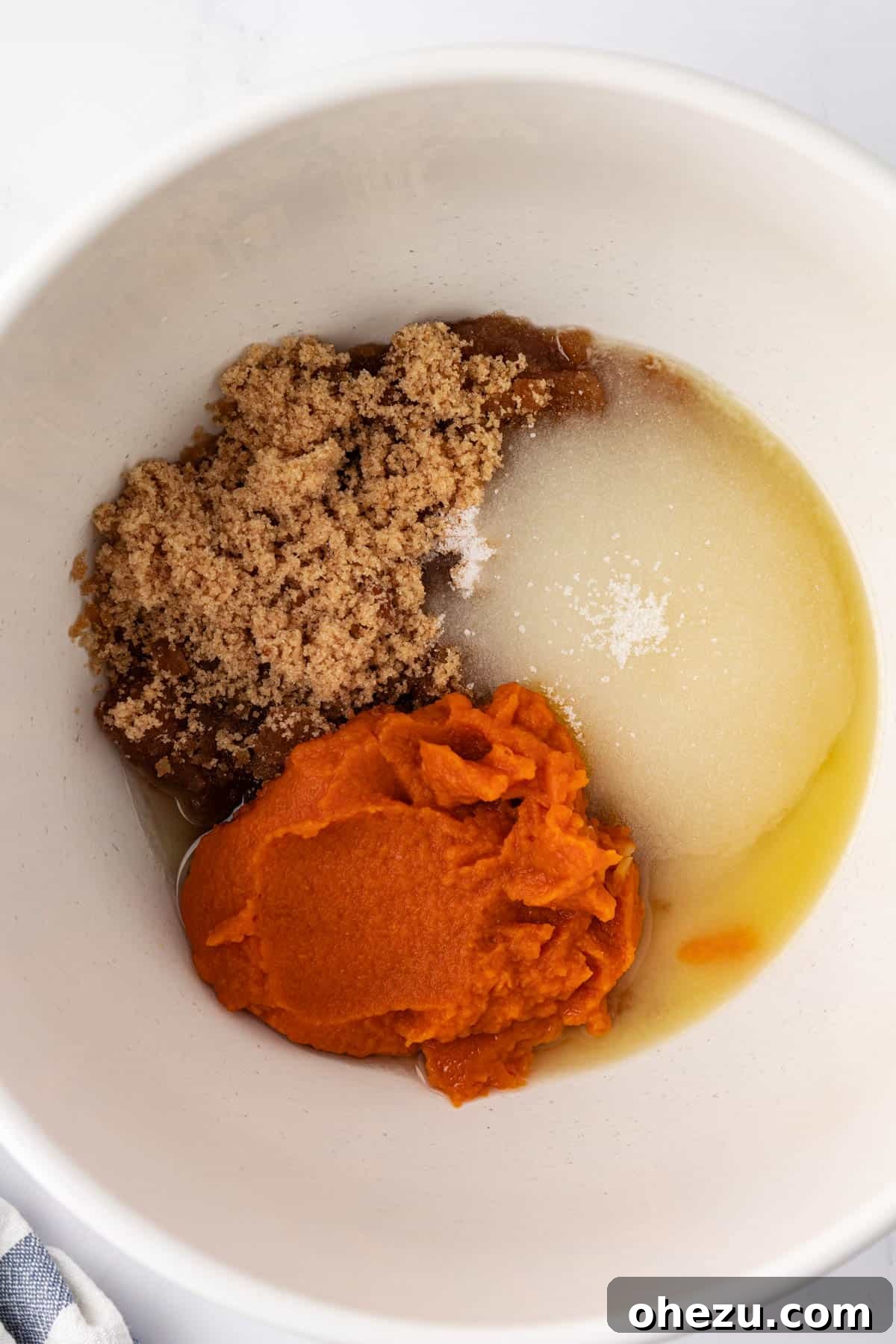 Wet ingredients in a mixing bowl before mixing