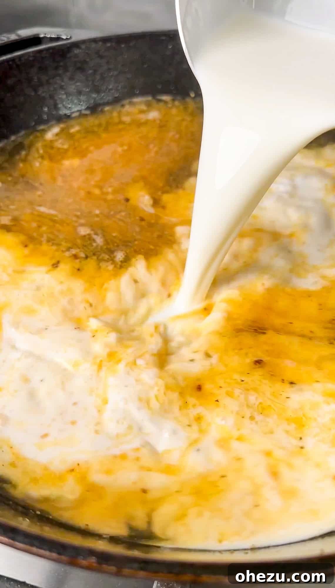 Creating the pan sauce with garlic and liquids