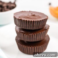 A tempting stack of homemade vegan peanut butter cups, a perfect recreation of a classic candy, tasting even better than the original.