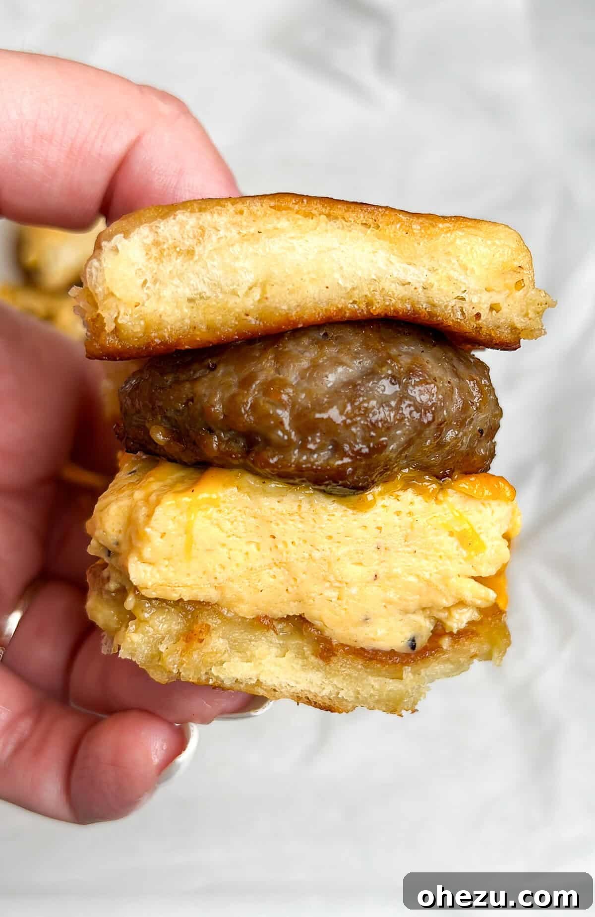 Delicious French Toast Sandwich on sweet Hawaiian rolls with eggs and bacon