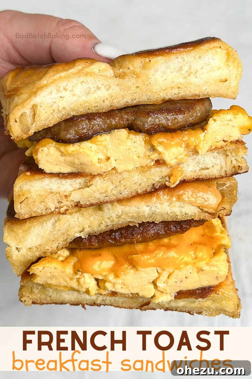 Two French Toast Sandwiches served on a plate with syrup