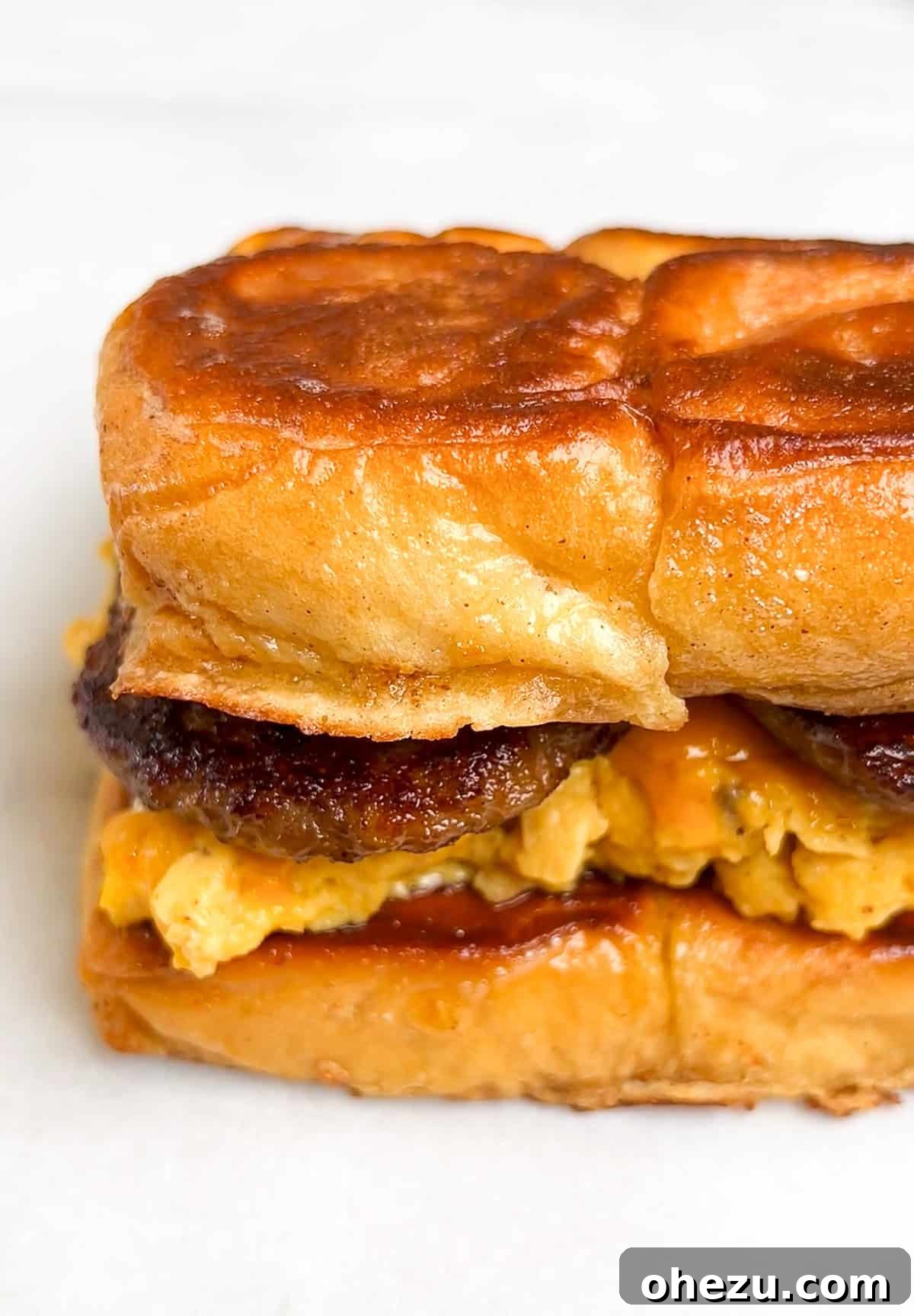 Assembled French Toast Sandwich with layers of eggs and bacon