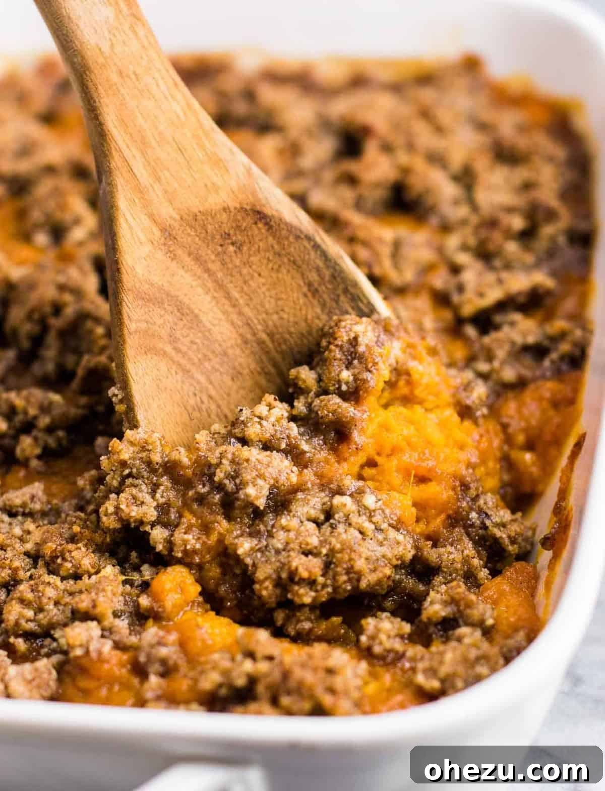 vegetarian thanksgiving menu - Gluten free sweet potato casserole with pecan crumble. This tastes incredible and everyone loves it! #sweetpotatocasserole #thanksgiving #pecans #glutenfree #vegetarian