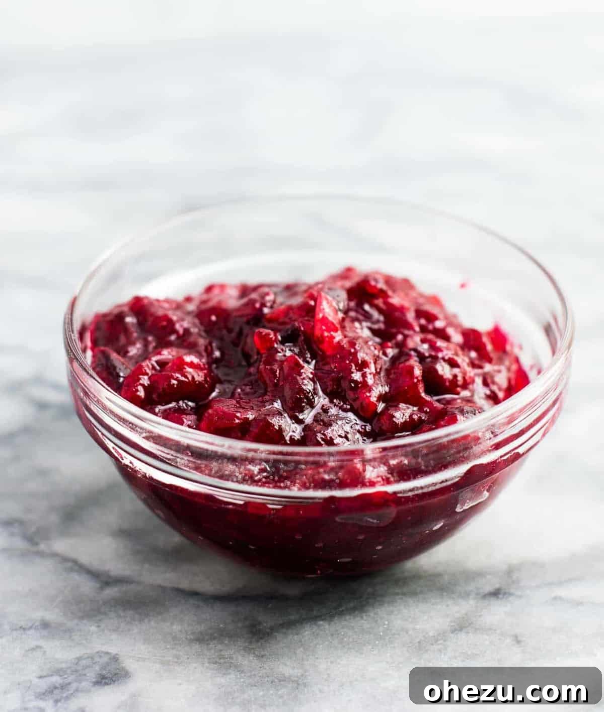 vegetarian thanksgiving menu - Healthy cranberry sauce recipe (vegan). Only 3 ingredients and low sugar. The best cranberry sauce I have ever had! We make this every year. #cranberrysauce #thanksgiving #vegan #vegetarian #healthycranberrysauce #freshcranberries