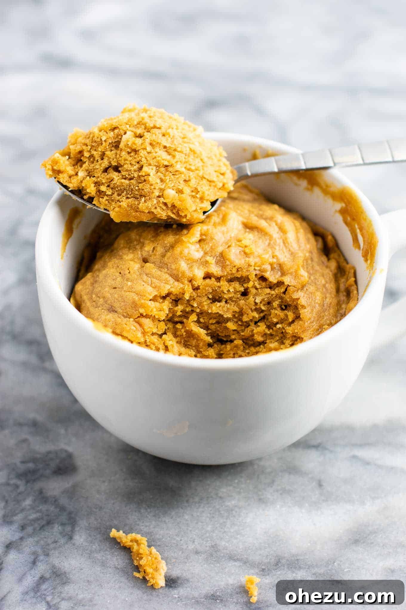 Another enticing photo of the peanut butter cookie in a mug, emphasizing its convenience and homemade goodness. A perfect gluten-free, dairy-free, and refined sugar-free snack.